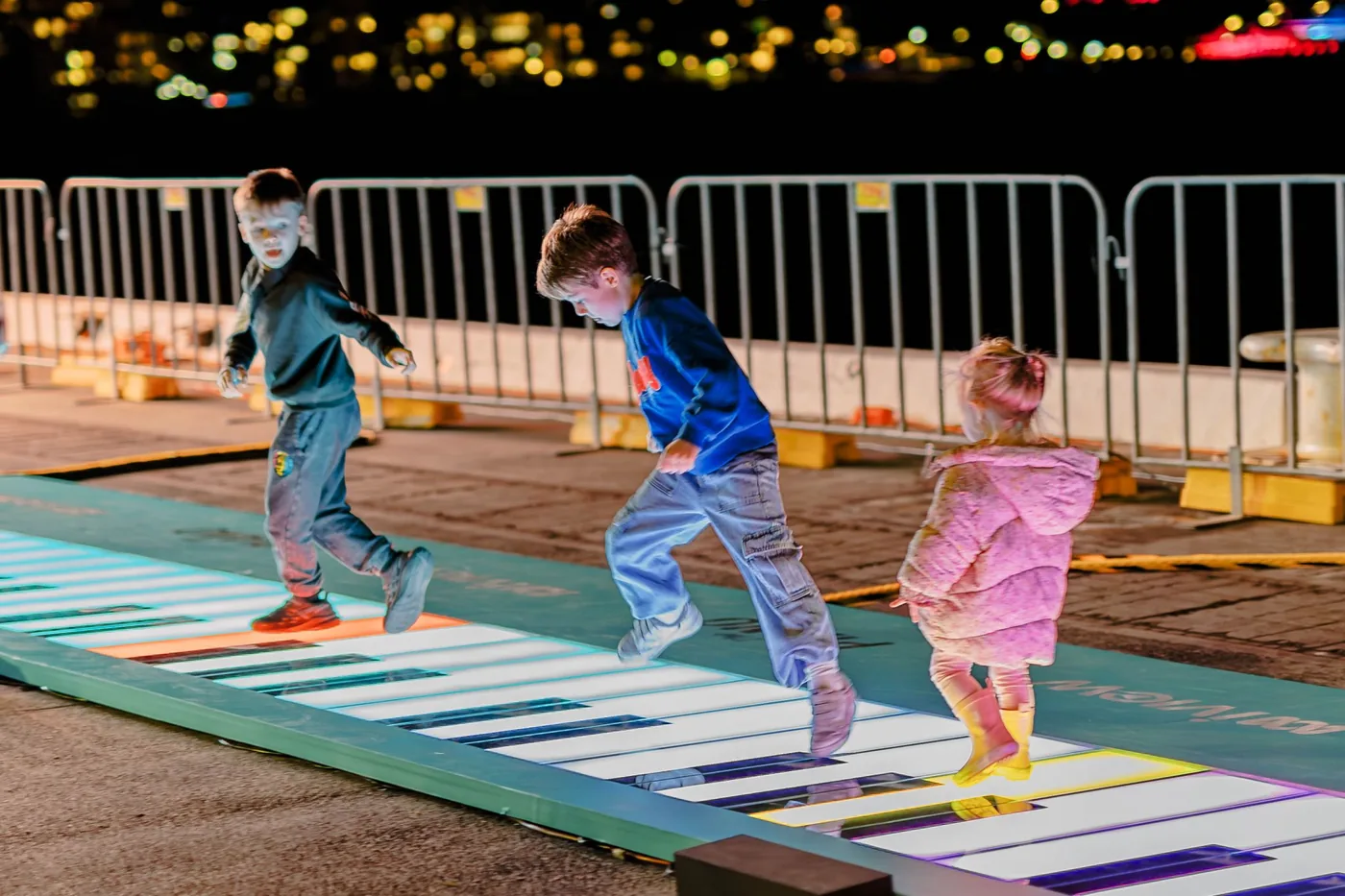 Interactive LED floor with children playing at an evening event