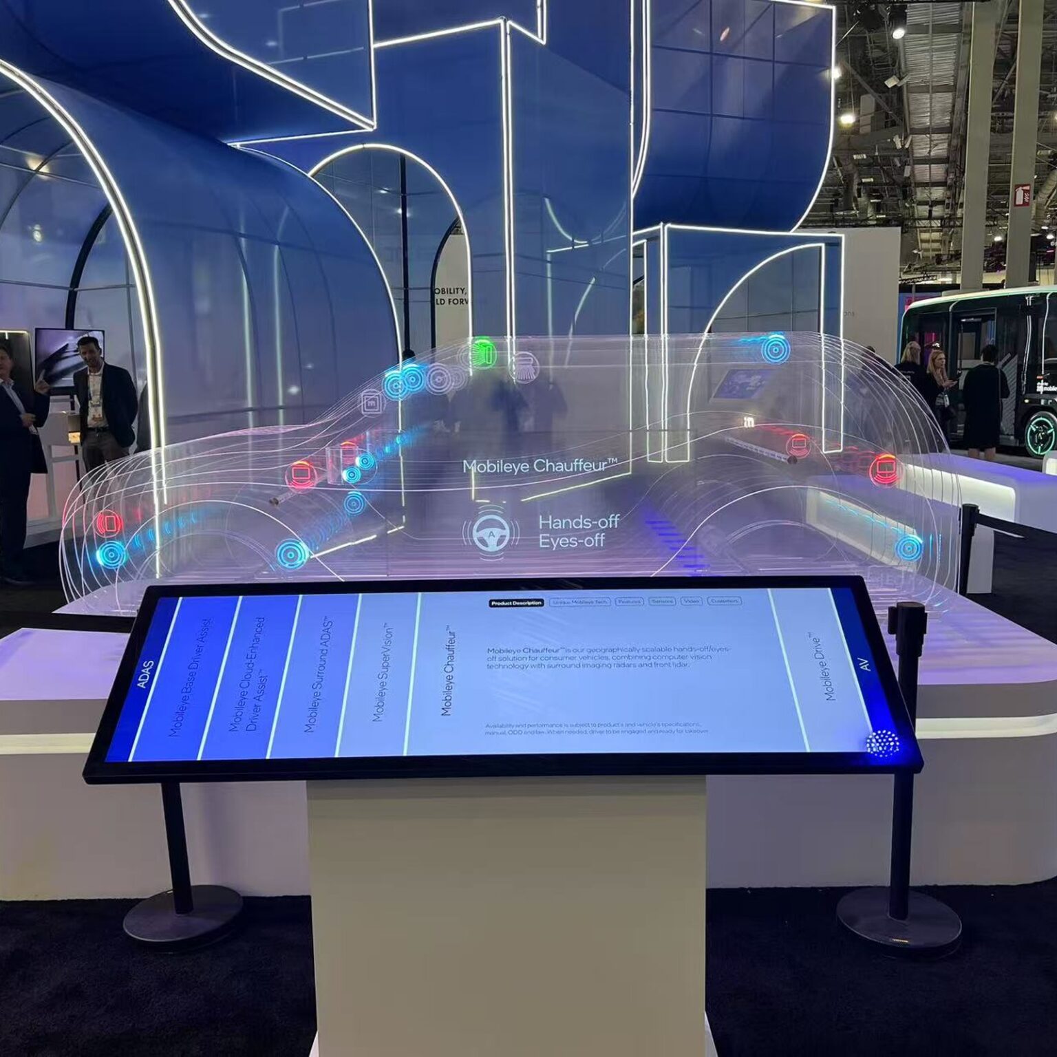 Transparent OLED ribbon display showing vehicle sensor data at an automotive technology exhibition